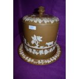 An impressive Jasperware stilton dome in the styled f Wedgwood with biscuit coloured ground and