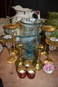 A mixed lot including brass and glass candle sticks and tea light holders.