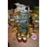 A mixed lot including brass and glass candle sticks and tea light holders.