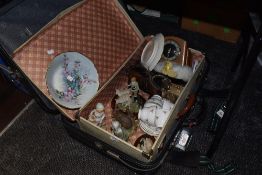 Two suitcase, one vintage and a mixed lot of figurines, cups and saucers and clocks within it.