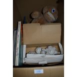 A box of general books, a childrens ceramic tea set and a zippy toy.
