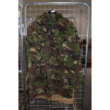 A camouflage coat having four pockets to front