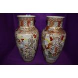 Two large highly decorated oriental vases.