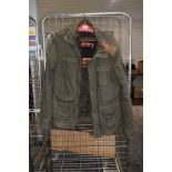 A gents army green Superdry coat,having faux fur lining, size L.