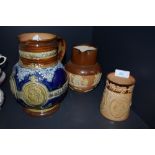 A selection of antique jugs including Queen Victoria Royal Doulton and similar Doulton