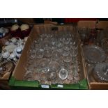 A large assortment of vintage and retro drinking glasses.