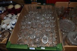 A large assortment of vintage and retro drinking glasses.