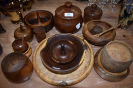 A selection of turned wooden items amongst which are bowls,lidded pots and more,around twenty