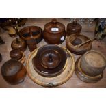A selection of turned wooden items amongst which are bowls,lidded pots and more,around twenty