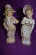 Two vintage classically dressed figurines of a boy and a girl.AF.