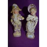 Two vintage classically dressed figurines of a boy and a girl.AF.