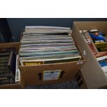 A box full of vinyl LP records including easy listening and pop.