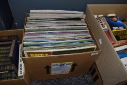 A box full of vinyl LP records including easy listening and pop.