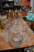 A variety of vintage glass decanters and selection of tazzas.