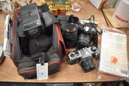 A collection of cameras and accessories including Pentax KX, Minolta,Sigma AP0 macro 70/300mm lens