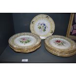 A set of ten antique porcelain plates in a Rockford style hand decorated with exotic flowers