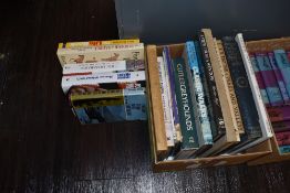 A box of books, of walking, travel and gardening interest.