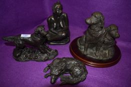 Four figurines,including limited edition Bette M curtis nude study, and three dogs including