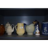 A varied lot of vintage ceramics and glass including jugs, tea pots and decanters.