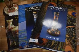 A large collection of Moorcroft Collectors club newsletter magazines and two books.
