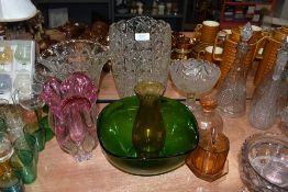 An assortment of heavy glass vases , green glass bowl and more.