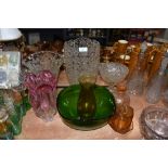 An assortment of heavy glass vases , green glass bowl and more.