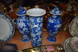A blue and white wear Chinese export mantle garniture including pair of cherry blossom decorated