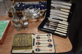 An assortment of plated ware and boxes of vintage cutlery including box of spoons with coffee