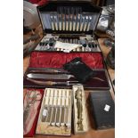 A selection of vintage flatware, part canteen of cutlery, a carver set with hallmarked silver