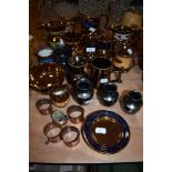 An assortment of vintage items including Prinknash bud vases, copper napkin rings,lustre detailed