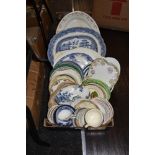 A large collection of vintage plates and platters, cups and saucers,lids and more.