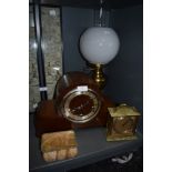 A brass bodied oil burning lamp and an art deco styled mantle clock, also agate box and Weiss clock