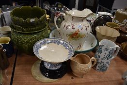 A mixed lot of vintage ceramics amongst which are two green planters, several jugs , cake stand