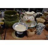 A mixed lot of vintage ceramics amongst which are two green planters, several jugs , cake stand