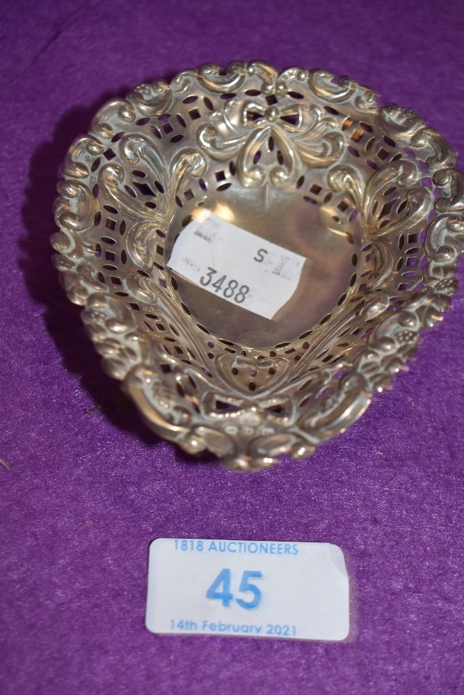 A small Victorian Hm silver pin dish having pierced rapousse decoration