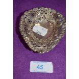 A small Victorian Hm silver pin dish having pierced rapousse decoration