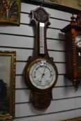 A vintage carved oak bodied barometer with enamel face dial glass AF