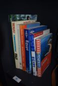 An assortment of Travel guides and gardening books.