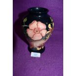 A Moorcroft vase of baluster form,Oberon designed by Rachel Bishop, having peach and navy ground