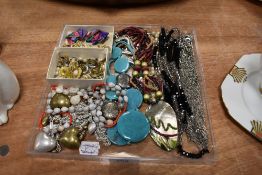 A collection of vintage and modern costume jewellery including clip on earrings and colourful