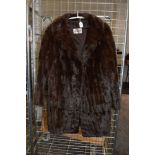 A vintage fur coat having half belt to back.