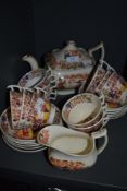 An antique part tea service by Hilditch & Son in a Chinoiserie style with London design tea cups and