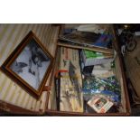 A suitcase containing a selection of vintage Airfix kits, marbles and Triang railway magazines and