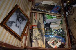 A suitcase containing a selection of vintage Airfix kits, marbles and Triang railway magazines and