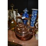 A vintage copper kettle and a copper tray.
