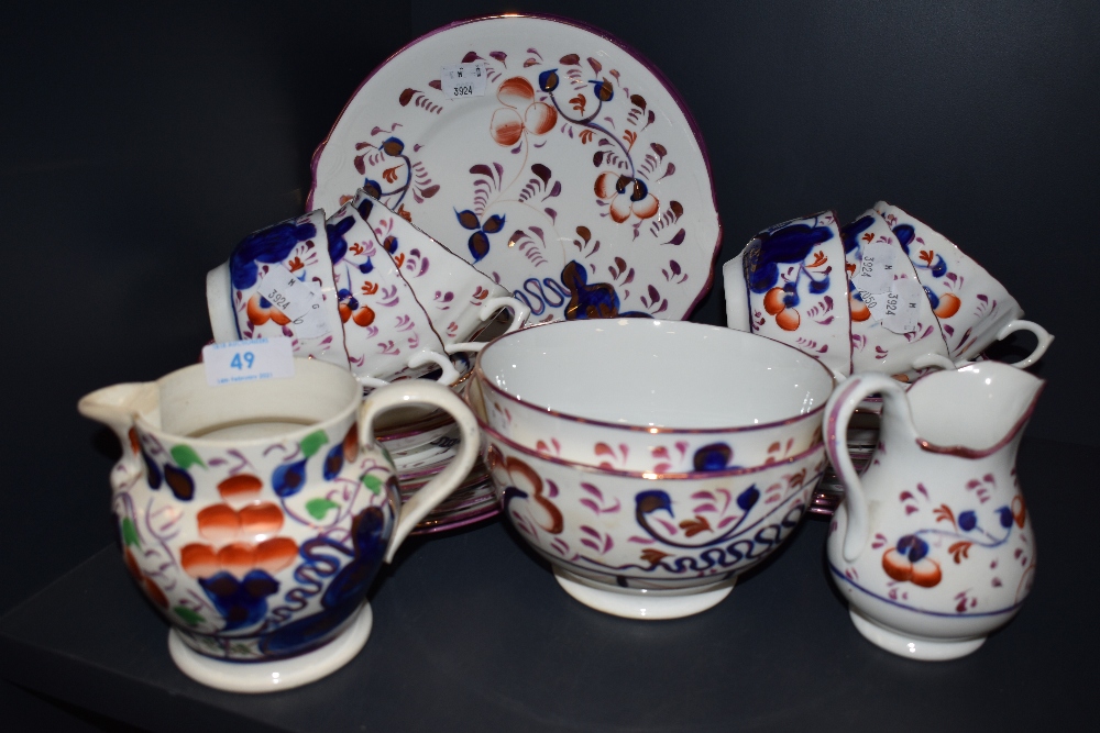 A part tea service hand decorated in Sunderland Lustre design compirising of slop bowls teacups