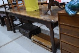 An antique cottage farm house dining or food preporation table in a provincial French design