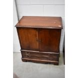 A reproduction mahogany TV cabinet, width approx. 80cm