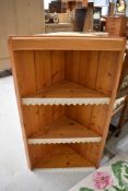 A natural pine corner shelf