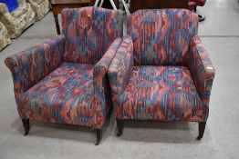 A pair of low deep set art deco lounge chairs , with later upholstery
